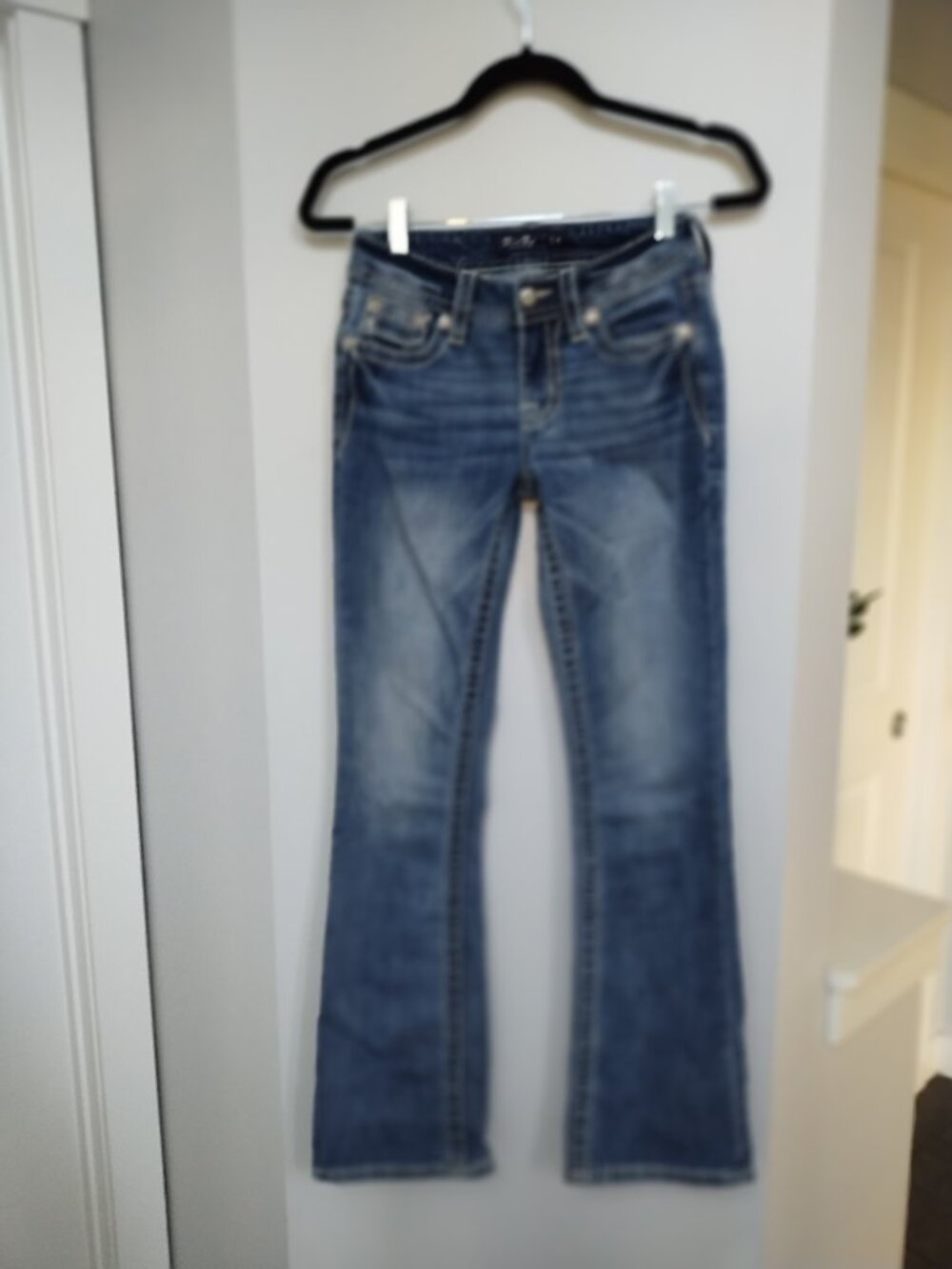 Miss Me Mid Rise boot cut jeans